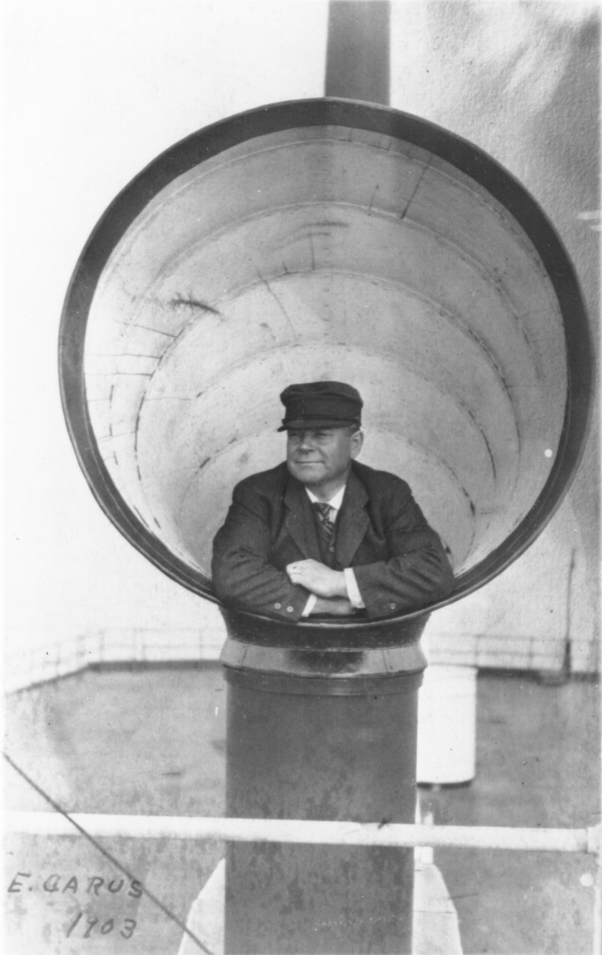 Captain Carus inside a large, round ventilator hood