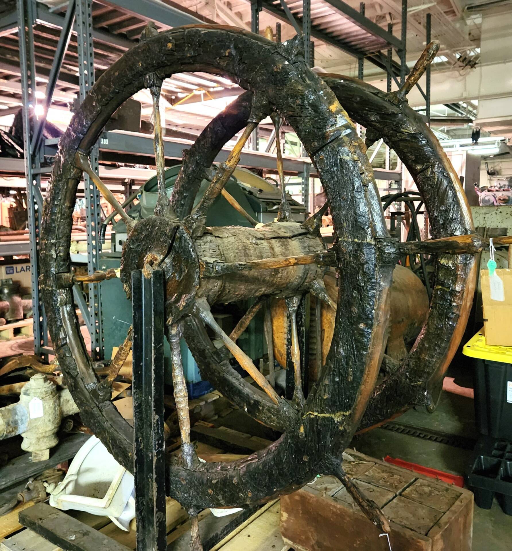 Shipwreck artifact - Large double wood wheels in storage.