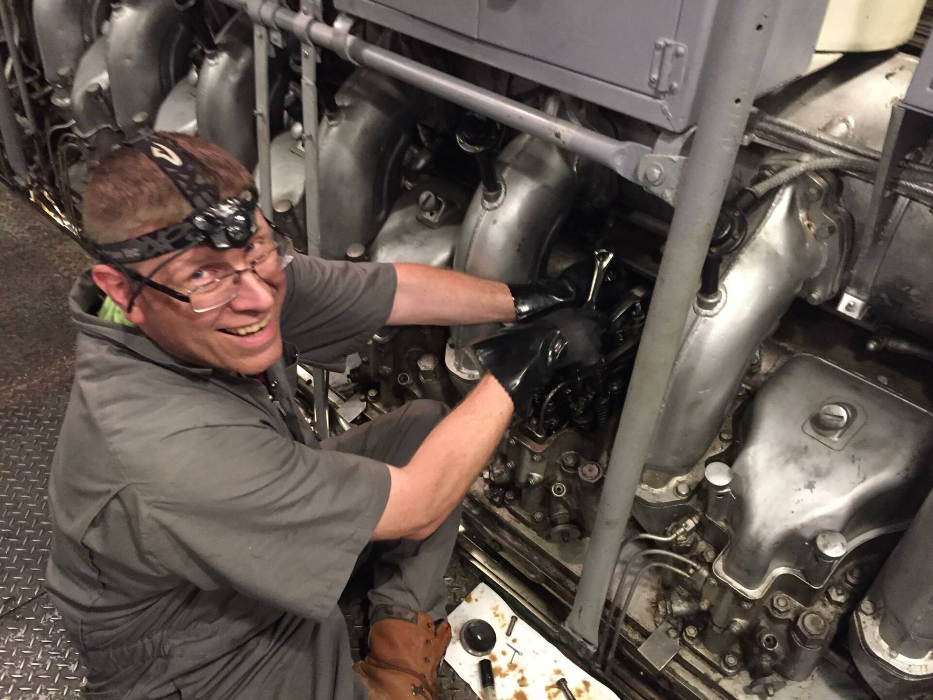 A volunteer working on the sub's engine