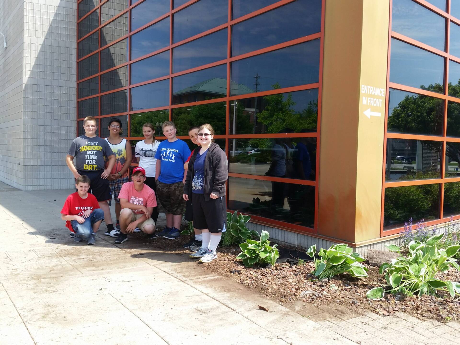 Y Teens Planting Project 6-14-16 Teen volunteers helping with landscaping